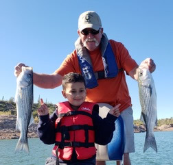 AZ Fishing trip customer with kids and several fish